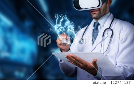 Doctor in Virtual Reality Headset Examining Digital Heart Model with Medical Data Visualization and Technology Integration in Healthcare Environment. PHMT 122744187