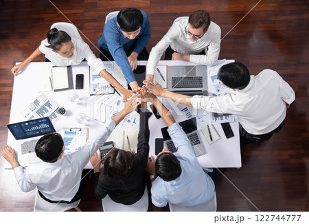 Group of diverse office worker join hand together in office. Prudent Group of diverse office worker join hand together in office. Prudent 122744777