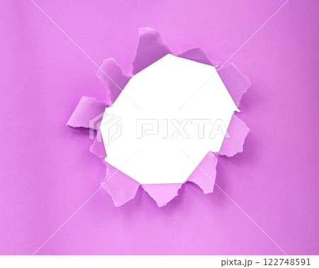 Pink color paper with circle hole in damaged background Pink color paper with circle hole in damaged background 122748591