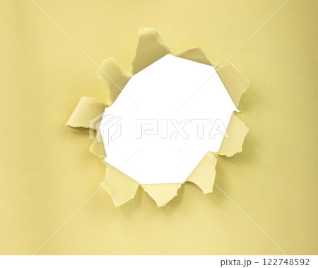 Yellow color paper with circle hole in damaged background Yellow color paper with circle hole in damaged background 122748592