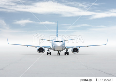 Front view of the white passenger jetliner isolated on bright background with sky Front view of the white passenger jetliner isolated on bright background with sky 122750981