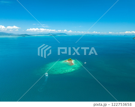 Aerial view Beautiful sea in summer season,Aerial flying drone view Waves water surface texture on sunny tropical ocean in Phuket island Thailand 122753658