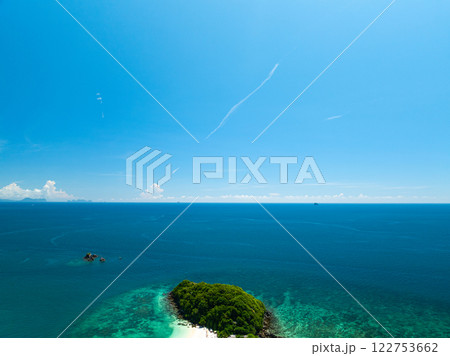 Aerial view Beautiful sea in summer season,Aerial flying drone view Waves water surface texture on sunny tropical ocean in Phuket island Thailand 122753662