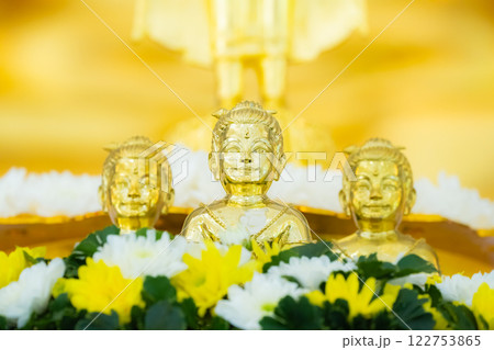 Portrait of three Golden boy Kumanthong top altar with flower. Kumanthong is be soul of a boy and superstition about spiritual in Thailand. 122753865