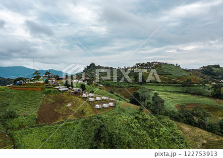 An aerial photographic view of Mon Jam Village in Chiangmai, filled with houses, resorts, and homestays for all the visitors. An aerial photographic view of Mon Jam Village in Chiangmai, filled with houses, resorts, and homestays for all the visitors. 122753913