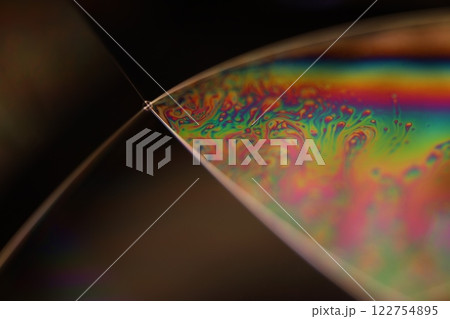 Green liquid surface on the dark background, colourful abstract, green shapes, minimalism, line of light, shapes on black background  122754895