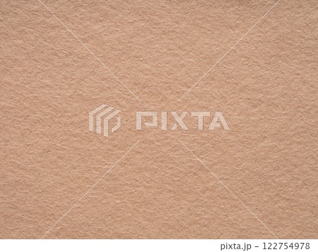 A detailed exploration of felt's comforting texture highlights the warmth in its subdued beige tone 122754978