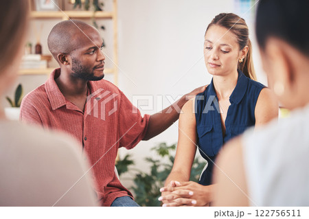 Support, comfort and console member in a therapy team meeting or gathering. Communication or caring employees showing empathy to sad woman with mental health problem in work group therapy session 122756511