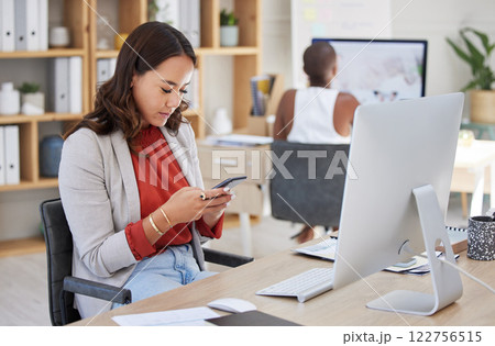 Office woman, desk and reading phone message and communication while working in corporate building. Young business executive and professional workplace girl looking at text on smartphone. 122756515