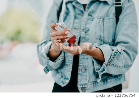 Closeup of woman using hand sanitizer while in public or travelling with copy space. Female practicing good health and hygiene, sticking to corona regulations. Lady suffering from OCD or germ phobia Closeup of woman using hand sanitizer while in public or travelling with copy space. Female practicing good health and hygiene, sticking to corona regulations. Lady suffering from OCD or germ phobia 122756754