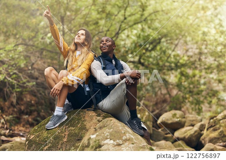 Hiking, freedom and couple relax on rock while looking at the nature, trees or calm sky outdoors. Relax and motivation with man and woman on sports, fitness and health and wellness mindset walk Hiking, freedom and couple relax on rock while looking at the nature, trees or calm sky outdoors. Relax and motivation with man and woman on sports, fitness and health and wellness mindset walk 122756897