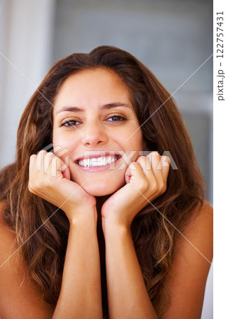 Happy face and smile with healthy mouth, teeth and good oral or dental hygiene beauty. Portrait of a woman with joyful facial expression and happiness, confident and joy while relax at home 122757431