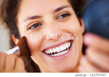 Face, beauty and makeup cosmetic brush on a woman with a happy and positive smile. Clear skin, healthy teeth and dental teeth whitening care results of a smiling female with glamour cosmetics 122757437