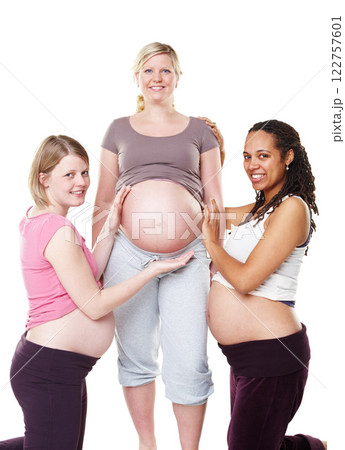 Pregnant, portrait and woman friends with studio background mockup for maternity photography. Mother, friendship and happy ladies smiling while holding growing and healthy pregnancy belly. Pregnant, portrait and woman friends with studio background mockup for maternity photography. Mother, friendship and happy ladies smiling while holding growing and healthy pregnancy belly. 122757601