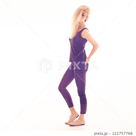 Beauty, fashion and sexy with a woman model posing in studio isolated on a white background. Blonde female feeling confident, elegant and beautiful with bright, colorful and creative lighting Beauty, fashion and sexy with a woman model posing in studio isolated on a white background. Blonde female feeling confident, elegant and beautiful with bright, colorful and creative lighting 122757766