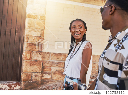 Love, happy couple and summer travel walking on a date with a smile. Smiling young woman and man on a summer outdoors walk together with sun, funny conversation and caring communication with a laugh 122758112