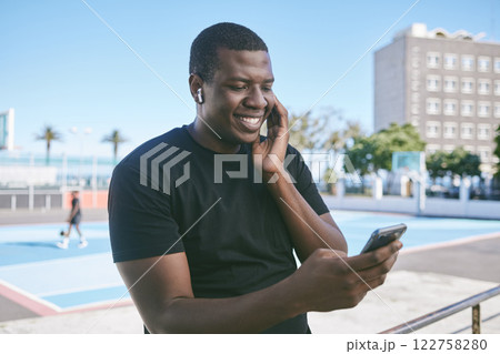 Black entrepreneur on social media and phone listening audio with wireless earphones in city street. Ecommerce tech, online shopping, video call read emails and happy freelance worker man outdoors. Black entrepreneur on social media and phone listening audio with wireless earphones in city street. Ecommerce tech, online shopping, video call read emails and happy freelance worker man outdoors. 122758280