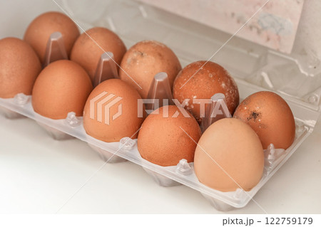 White mould on eggs that have been stored in wet fridge for long time White mould on eggs that have been stored in wet fridge for long time 122759179