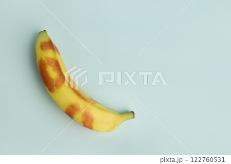 Blow job . A banana decorated with traces of red lipstick. Oral Sex and Concept Blow job . A banana decorated with traces of red lipstick. Oral Sex and Concept 122760531