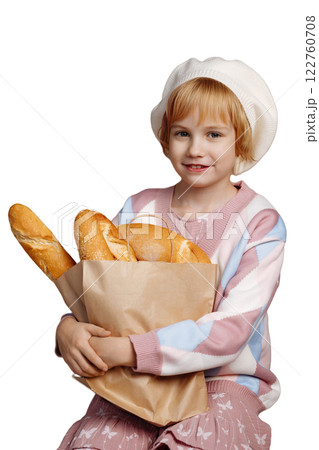 Young baker girl holding baguettes isolated on white background with copy space Young baker girl holding baguettes isolated on white background with copy space 122760708