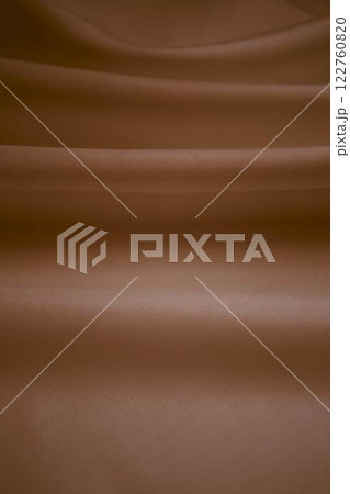 abstract background, a wallpaper, fabric waves, color gradient, silk, satin light Mocha Mousse, orange, banner 122760820