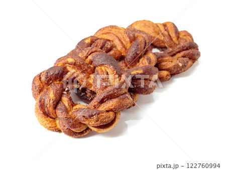 Homemade soft pretzels with cinnamon and sugar isolated on white background. 122760994