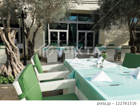Cafe tables and chairs outside in Antalya Turkey hotel resort Cafe tables and chairs outside in Antalya Turkey hotel resort 122761516