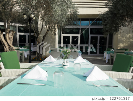 Cafe tables and chairs outside in Antalya Turkey hotel resort Cafe tables and chairs outside in Antalya Turkey hotel resort 122761517