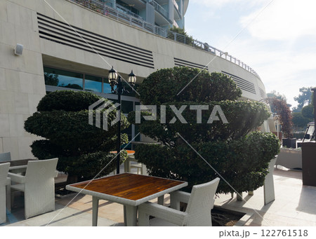 Cafe tables and chairs outside in Antalya Turkey hotel resort Cafe tables and chairs outside in Antalya Turkey hotel resort 122761518
