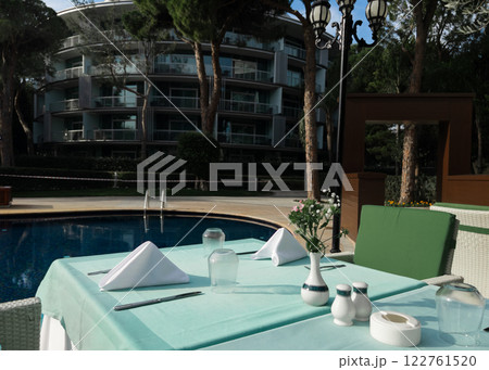 Cafe tables and chairs outside in Antalya Turkey hotel resort  122761520