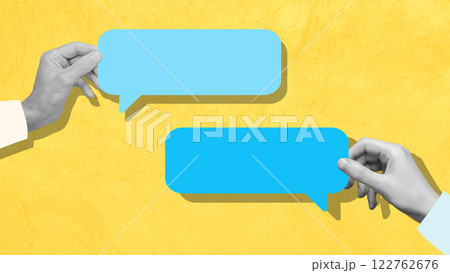Hands holding blue speech bubbles, symbolizing business communication, dialogue, and idea sharing. 122762676