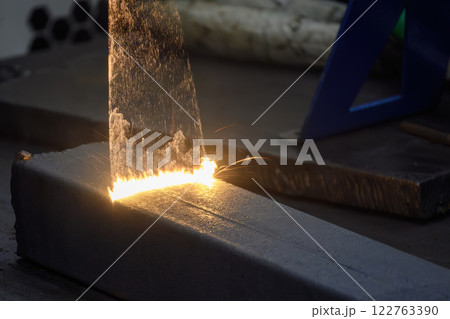 Close up scene rust cleaning process by portable laser cleaning machine. 122763390