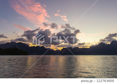 A beauty of Cheow Lan Dam or Rajjaprabha Dam Reservoir is in Khao Sok National Park in Surat Thani, Thailand A beauty of Cheow Lan Dam or Rajjaprabha Dam Reservoir is in Khao Sok National Park in Surat Thani, Thailand 122763600