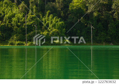 A beauty of Cheow Lan Dam or Rajjaprabha Dam Reservoir is in Khao Sok National Park in Surat Thani, Thailand A beauty of Cheow Lan Dam or Rajjaprabha Dam Reservoir is in Khao Sok National Park in Surat Thani, Thailand 122763632