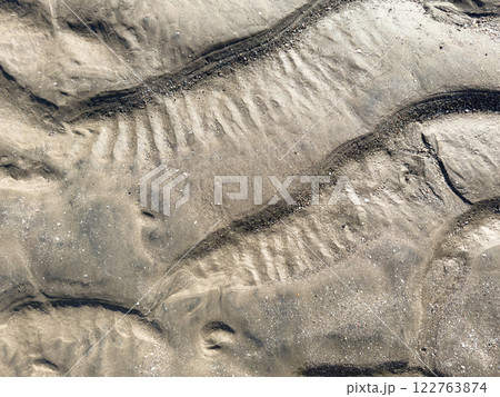 Rippled mud sand background Rippled mud sand background 122763874