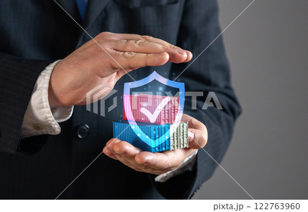 The businessman keeps sea cargo containers under a guarantee of protection. Trade security, logistics protection, freight insurance, supply chain stability, international business. Risk management The businessman keeps sea cargo containers under a guarantee of protection. Trade security, logistics protection, freight insurance, supply chain stability, international business. Risk management 122763960