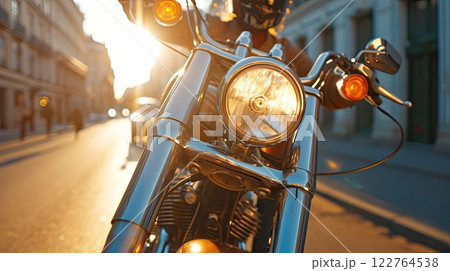 With style and speed, the motorcyclist navigates urban traffic, leaving a trail of excitement in their wake. Cropped photo. 122764538