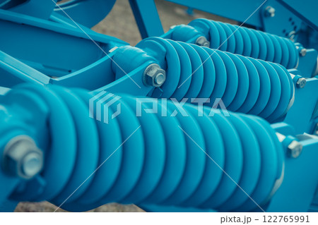 Steel blue spring as part of agricultural machine. Technology 122765991