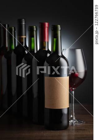 Bottles of wine on a old wooden table. 122766789