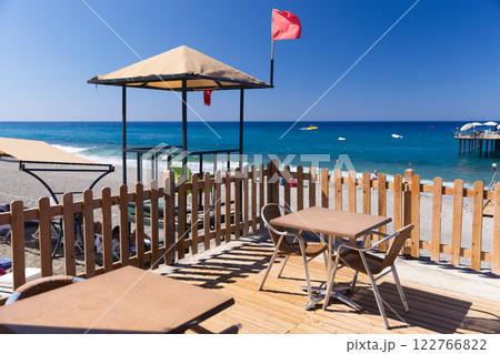 Coastal landscape with a Lifeguard station under blue sky Coastal landscape with a Lifeguard station under blue sky 122766822