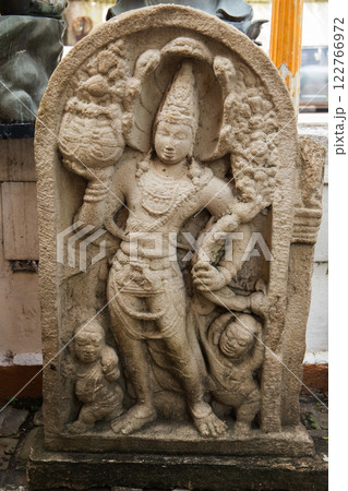 Ancient stone statue at Gangaramaya Temple Ancient stone statue at Gangaramaya Temple 122766972