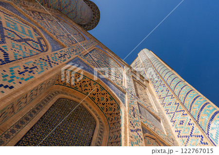 Exterior of Ulugh Beg Madrasah under blue sky on a sunny day 122767015