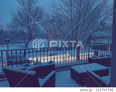 Snowy Balcony View During Winter Evening Snowy Balcony View During Winter Evening 122767748