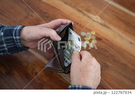 Counting the last euros Counting the last euros 122767834