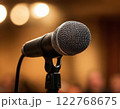Professional microphone set up on stage with soft background lighting. Generated AI. 122768675