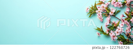 The lush cherry blossom branch enhances the soft pastel background, symbolizing the elegance and purity of spring in a calm, peaceful setting, banner 122768726