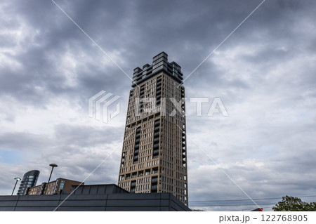 Modern High Rise Tower Against Dramatic Cloudy Sky in London 122768905