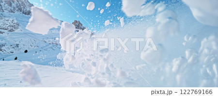 White powder explosion with high mountains on background. 122769166