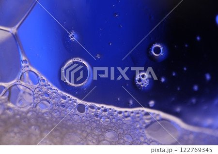 Blue liquid surface reflection, bright fluid background, flat waves, smooth movement, deep colours Blue liquid surface reflection, bright fluid background, flat waves, smooth movement, deep colours 122769345