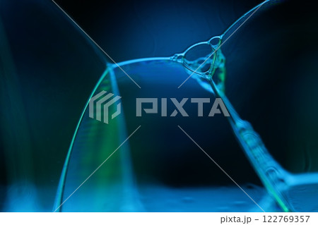 Blue and Green bubbles reflections on black background, liquid abstraction, colour waves, deep dark backgrounds, water surface 122769357